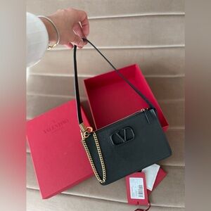 Valentino Garavani textured leather pouch with strap